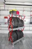 Стойка для колёс 2х4 на роликах с полкой